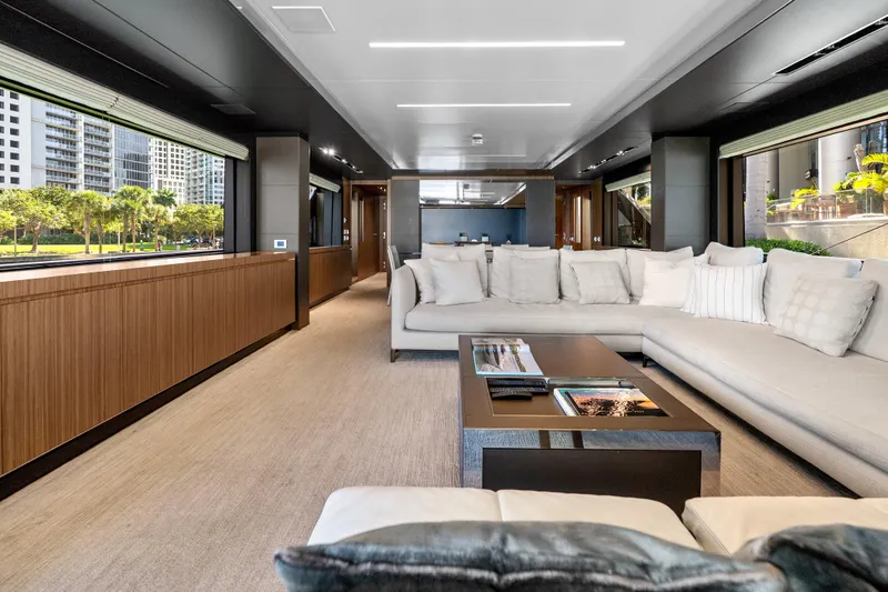 Slide: The Image of Luxurious interior of 2020 Riva 100' Corsaro yacht with modern furnishings and large windows. - 20