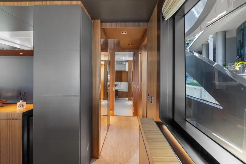 Slide: The Image of Luxurious interior of 2020 Riva 100' Corsaro yacht with modern wood finishes. - 24