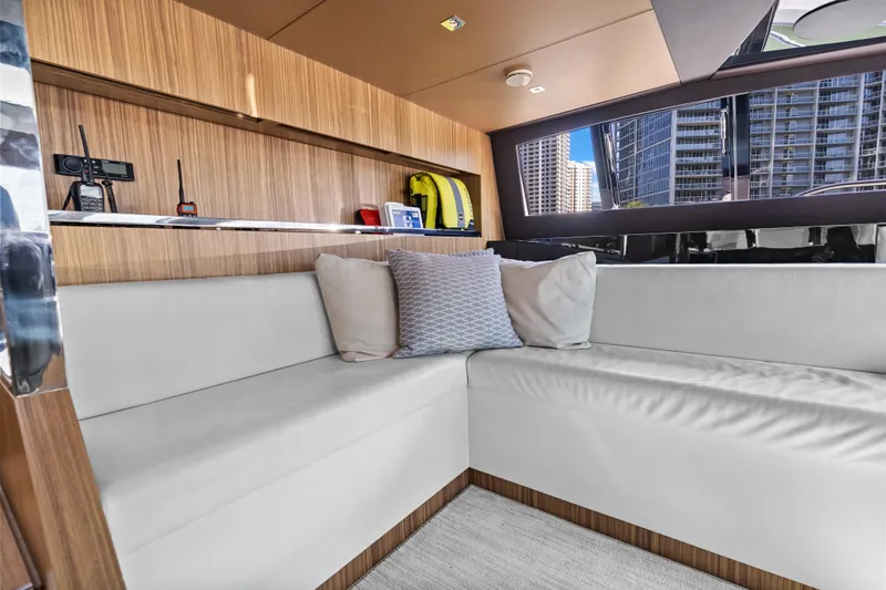 Slide: The Image of Luxurious interior of 2020 Riva 100' Corsaro yacht with modern seating and cityscape view. - 27