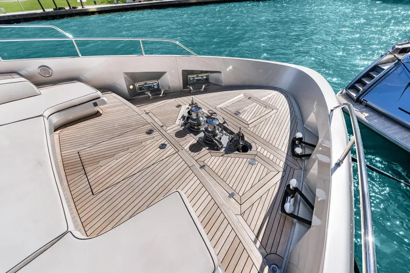 Slide: The Image of Luxurious 2020 Riva 100' Corsaro yacht deck with sleek wood finish and modern design. - 29