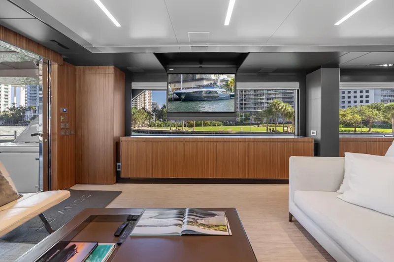 Slide: The Image of Luxurious interior of 2020 Riva 100' Corsaro yacht with modern design and city view. - 33