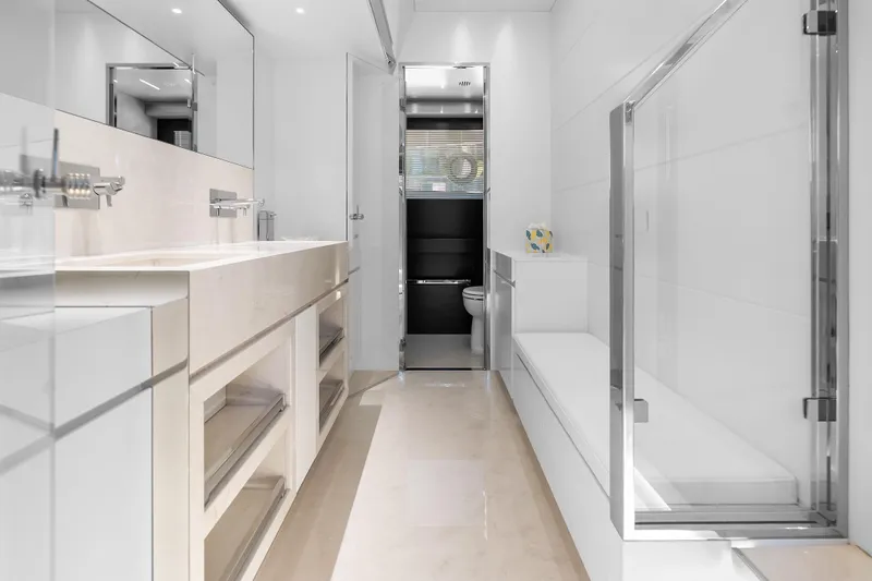 Slide: The Image of Luxurious bathroom interior on 2020 Riva 100' Corsaro yacht, featuring modern fixtures and elegant design. - 35