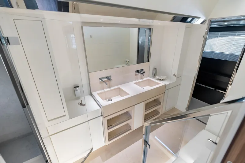 Slide: The Image of Luxurious bathroom interior on 2020 Riva 100' Corsaro yacht, featuring dual sinks and modern design. - 50