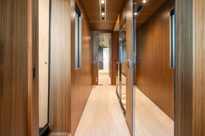 Slide: The Image of Luxurious wooden interior hallway of 2020 Riva 100' Corsaro yacht. - 54