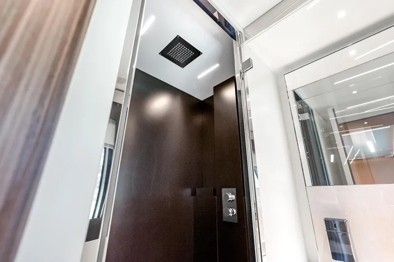 Slide: The Image of Luxurious shower interior on 2020 Riva 100' Corsaro yacht, featuring modern design elements. - 58