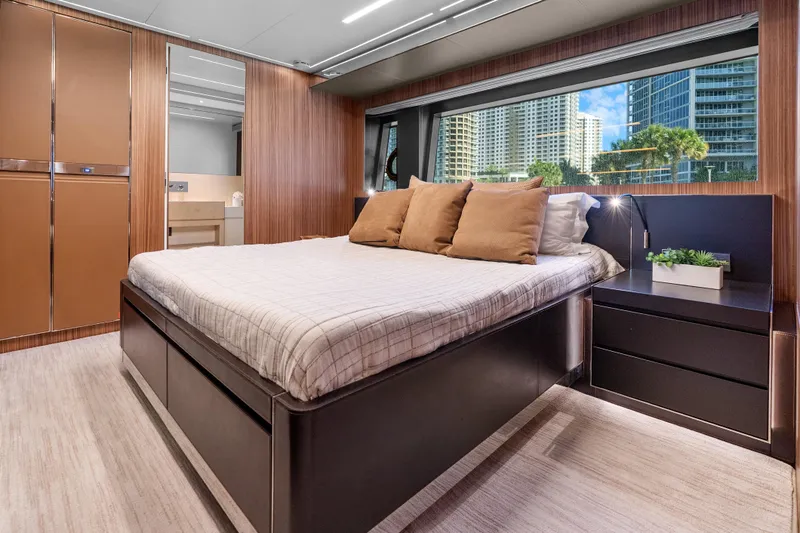 Slide: The Image of Luxurious bedroom interior of 2020 Riva 100' Corsaro yacht with modern design and city view. - 65