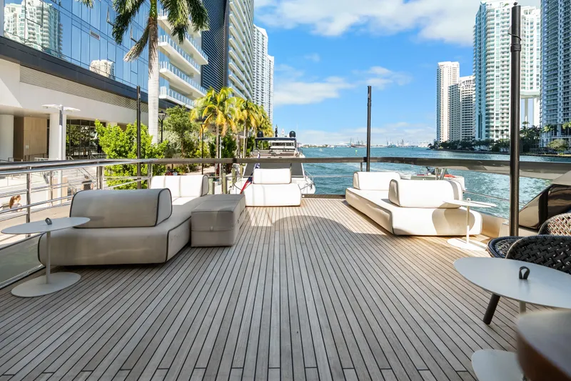 Slide: The Image of Luxurious deck of 2020 Riva 100' Corsaro yacht with city skyline view. - 7