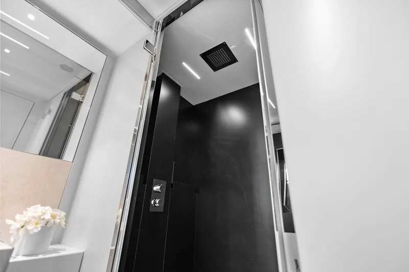 Slide: The Image of Luxurious shower interior on 2020 Riva 100' Corsaro yacht, featuring sleek modern design. - 77