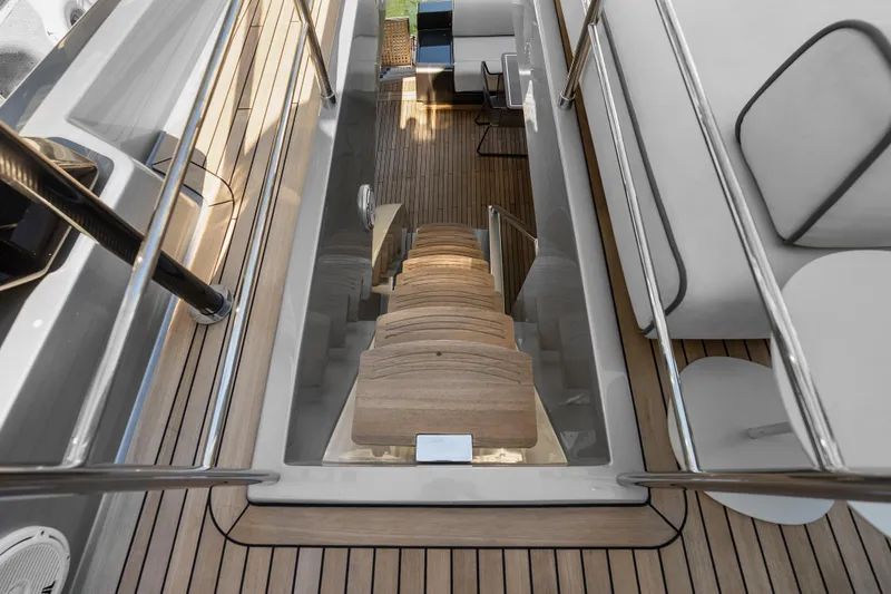 Slide: The Image of Staircase on 2020 Riva 100' Corsaro yacht with sleek wooden design. - 79