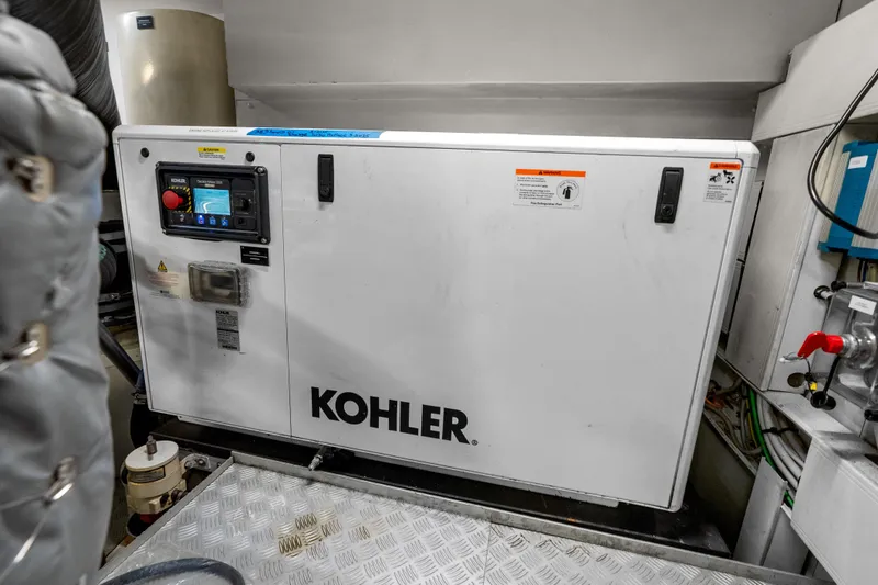 Slide: The Image of Engine room of 2020 Riva 100' Corsaro yacht featuring a Kohler generator. - 89