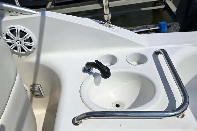 Slide: The Image of Cockpit sink and speaker on 2001 Sea Ray Sundancer 260 boat. - 16