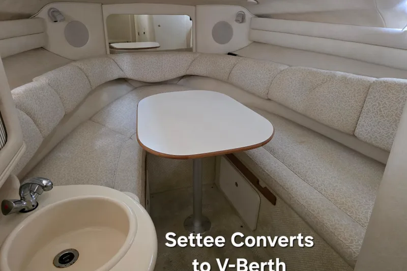 Slide: The Image of 2001 Sea Ray Sundancer 260 interior with convertible settee and V-berth. - 25