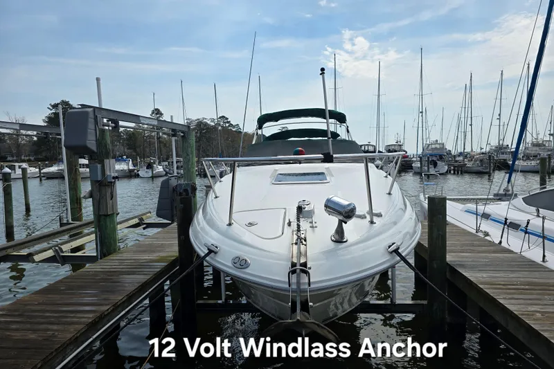Slide: The Image of Sea Ray Sundancer 260 boat docked, featuring a 12-volt windlass anchor system. - 3