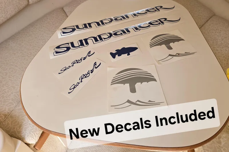Slide: The Image of New decals for 2001 Sea Ray Sundancer 260 displayed on a table. - 36
