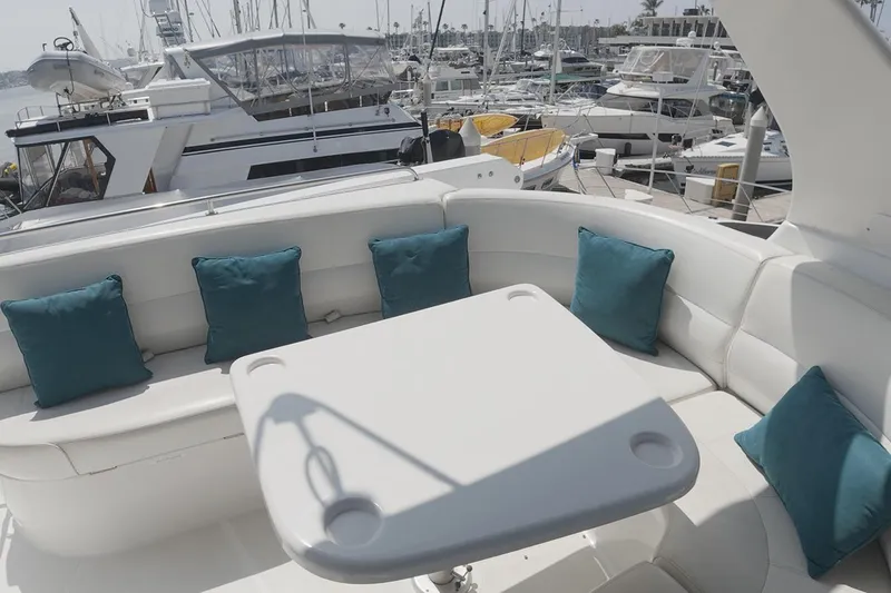 Slide: The Image of Luxurious seating area on 1999 Carver 53 Voyager yacht with teal cushions. - 20
