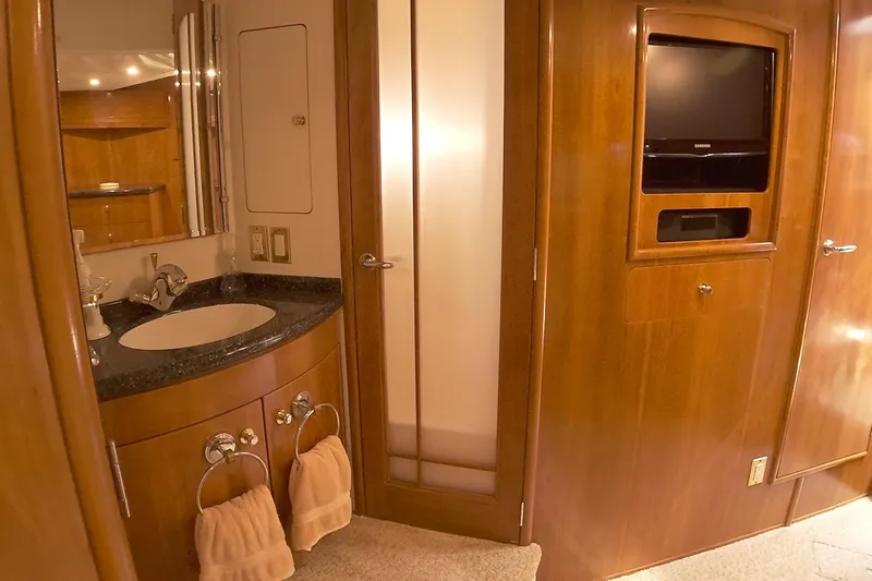 Slide: The Image of Luxurious bathroom interior of 1999 Carver 53 Voyager yacht with wood finish and modern amenities. - 23