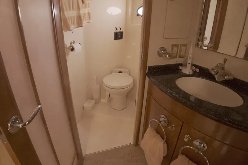 Slide: The Image of Bathroom interior of 1999 Carver 53 Voyager yacht with sink and toilet. - 25