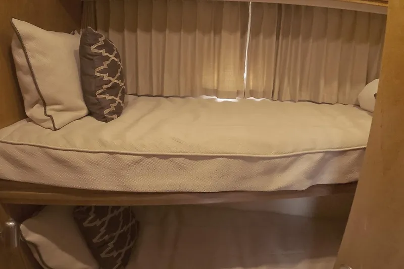 Slide: The Image of Bunk bed in 1999 Carver 53 Voyager yacht with pillows and curtains. - 27