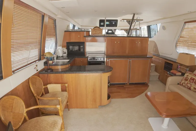 Slide: The Image of Luxurious interior of a 1999 Carver 53 Voyager yacht with modern kitchen amenities. - 6