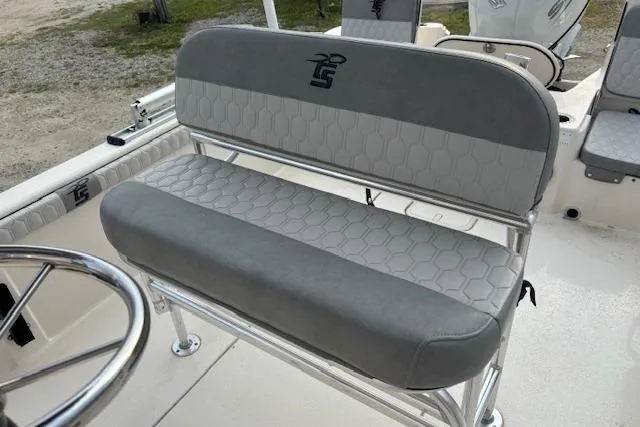 Slide: The Image of 2024 Carolina Skiff 25 LS boat seat with gray upholstery and hexagonal pattern design. - 12