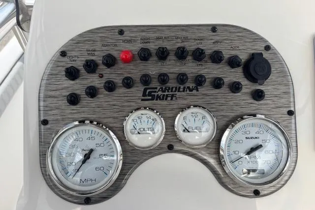 Slide: The Image of Dashboard of 2024 Carolina Skiff 25 LS boat with gauges and controls. - 13