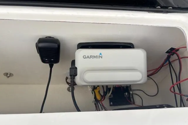 Slide: The Image of Garmin device installed in 2024 Carolina Skiff 25 LS boat compartment with wiring. - 15
