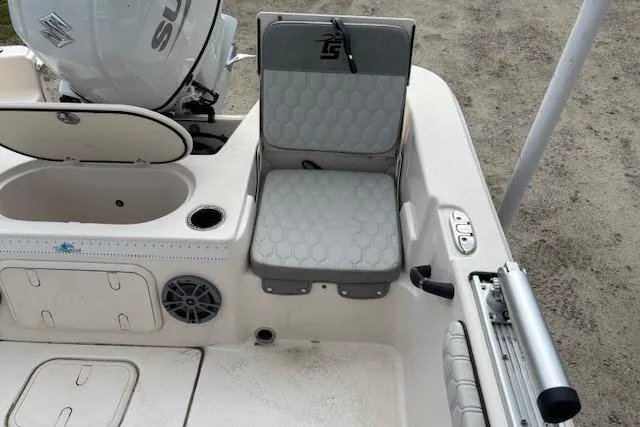 Slide: The Image of 2024 Carolina Skiff 25 LS boat interior with seating and storage compartments. - 16
