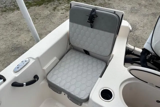 Slide: The Image of 2024 Carolina Skiff 25 LS boat seat with cup holder and storage compartment. - 17