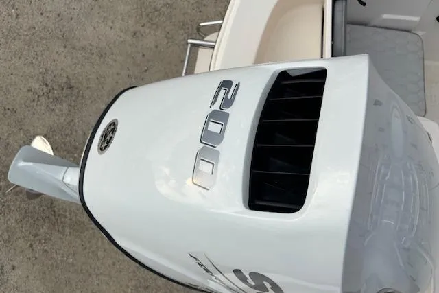 Slide: The Image of 2024 Carolina Skiff 25 LS boat with a 200 horsepower outboard motor. - 18