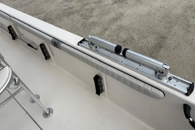 Slide: The Image of 2024 Carolina Skiff 25 LS boat interior with rod holder and seating. - 19