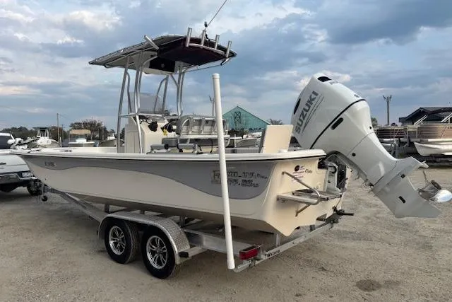 Slide: The Image of 2024 Carolina Skiff 25 LS boat on trailer with Suzuki outboard motor. - 3