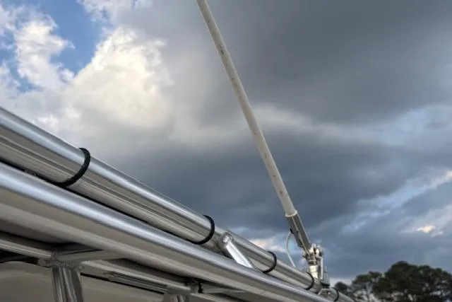 Slide: The Image of Close-up of 2024 Carolina Skiff 25 LS boat railing against cloudy sky. - 31