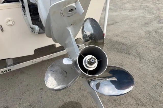 Slide: The Image of 2024 Carolina Skiff 25 LS boat propeller on a sandy surface. - 34