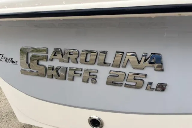 Slide: The Image of 2024 Carolina Skiff 25 LS boat logo on white surface. - 37