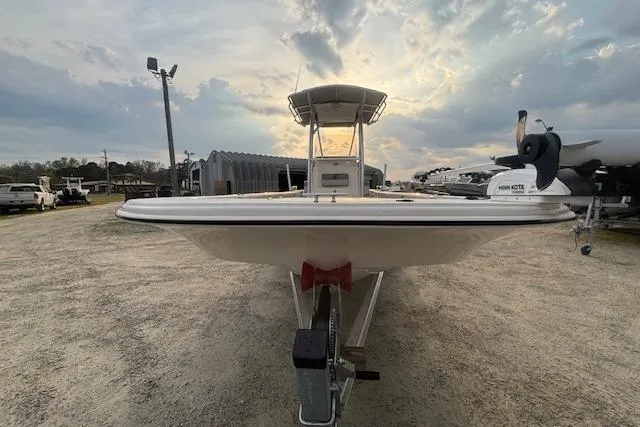 Slide: The Image of 2024 Carolina Skiff 25 LS boat on trailer at sunset, front view. - 6