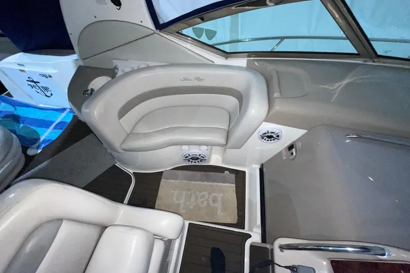 Slide: The Image of Interior of a 2002 Sea Ray Sundancer 320 boat with seating and nautical decor. - 12