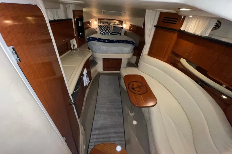 Slide: The Image of Interior of 2002 Sea Ray Sundancer 320 yacht with cozy seating and elegant wood finishes. - 20