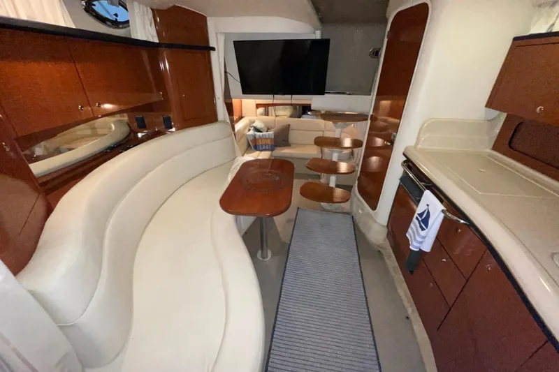 Slide: The Image of Luxurious interior of 2002 Sea Ray Sundancer 320 yacht with elegant seating and modern amenities. - 22
