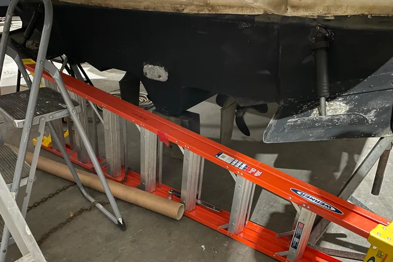 Slide: The Image of 2002 Sea Ray Sundancer 320 under maintenance with ladder and tools visible. - 29