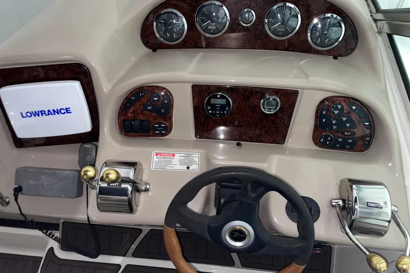 Slide: The Image of Control panel of a 2002 Sea Ray Sundancer 320 boat with Lowrance navigation system. - 3