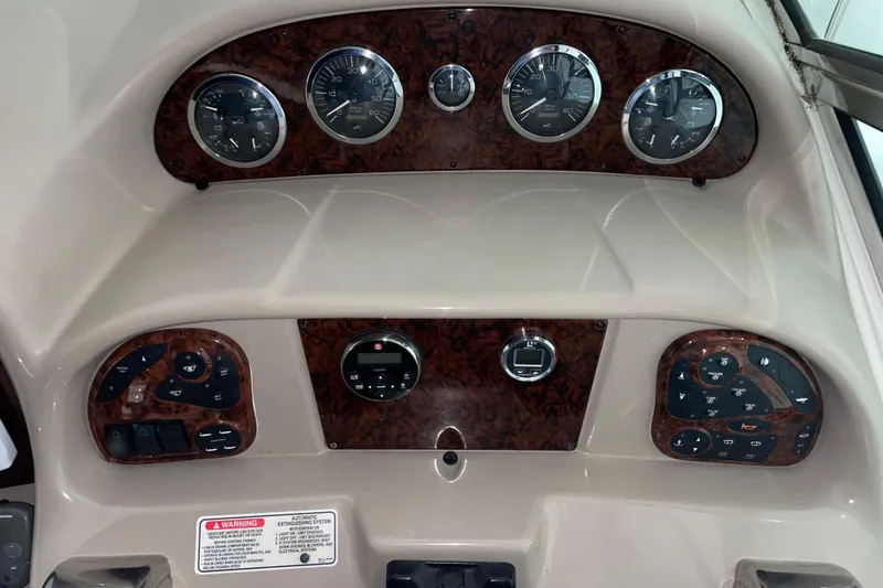 Slide: The Image of Dashboard of a 2002 Sea Ray Sundancer 320 boat with gauges and controls. - 4