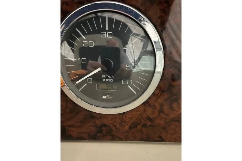 Slide: The Image of Close-up of a Sea Ray Sundancer 320 tachometer showing 5900 RPM. - 9