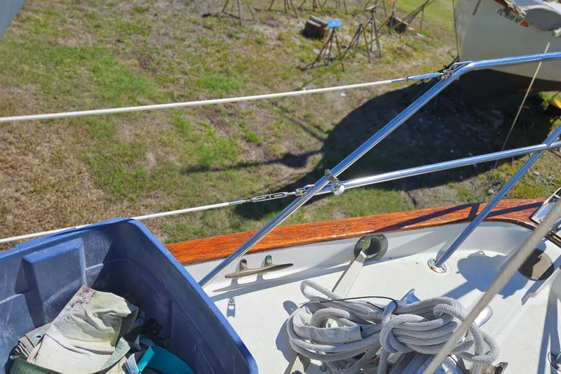 Slide: The Image of 1989 Pacific Seacraft 37 deck with yellow and red fuel containers. - 12