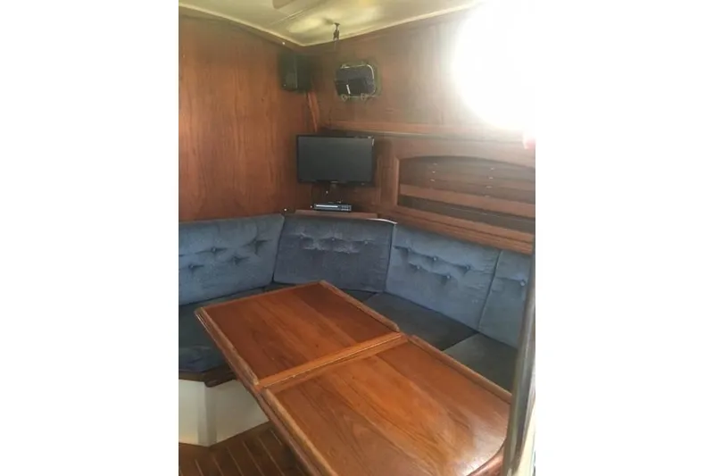 Slide: The Image of Cozy cabin interior of 1989 Pacific Seacraft 37 sailboat with wooden finishes. - 17