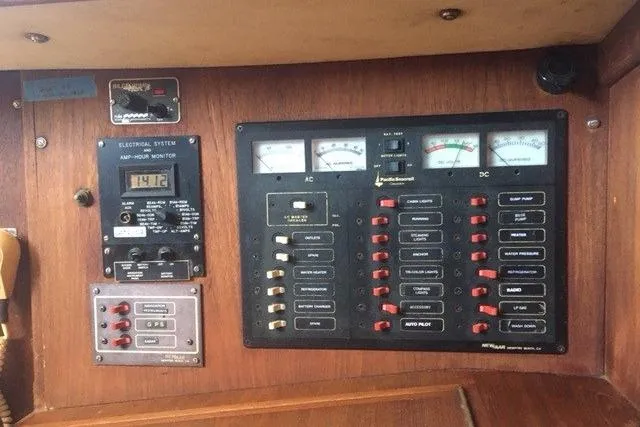 Slide: The Image of Cozy interior of 1989 Pacific Seacraft 37 with plush seating and mounted TV. - 31