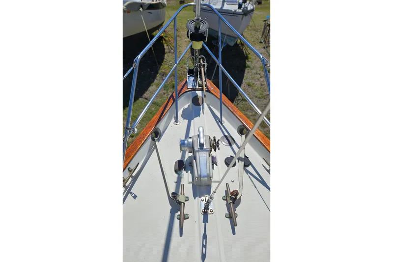 Slide: The Image of 1989 Pacific Seacraft 37 sailboat docked, featuring deck details and rigging. - 4
