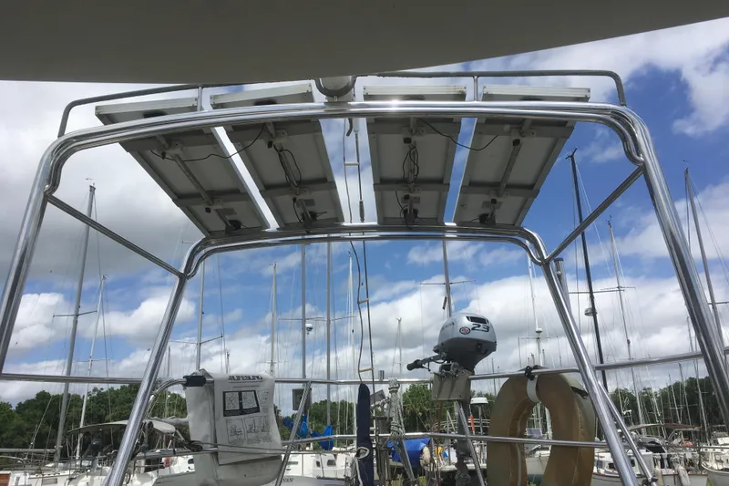 Slide: The Image of Solar panels on a 1989 Pacific Seacraft 37 sailboat with marina backdrop. - 41