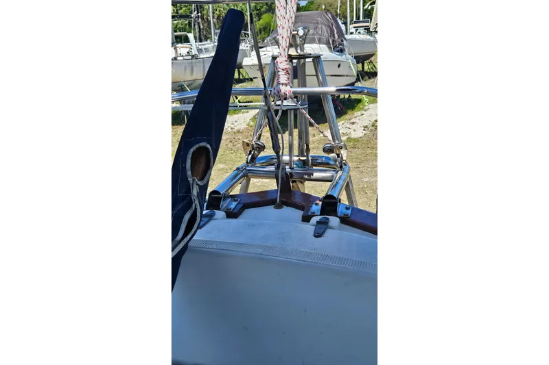 Slide: The Image of 1989 Pacific Seacraft 37 sailboat on stands, displayed outdoors under clear blue sky. - 5