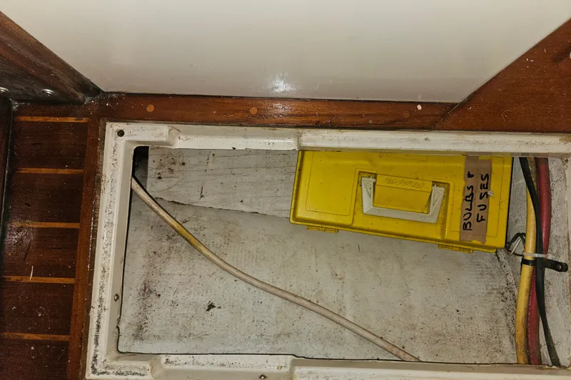 Slide: The Image of Yellow toolbox labeled "Bulbs & Fuses" in Pacific Seacraft 37, 1989 model. - 43