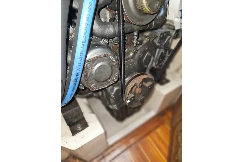 Slide: The Image of Engine compartment of a 1989 Pacific Seacraft 37 sailboat, featuring visible belts and components. - 40